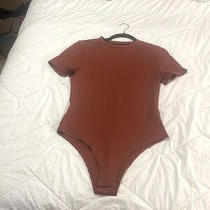 Burnt Orange body suit